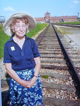 HN: In Auschwitz, 2010. "Six years ago, when I was eighty, I went to Auschwitz. And I knew my father by then had died there. And I wanted to have a photograph taken of me standing on the railway line, where my... railway carriage would, would, would stop. And then I also wanted to go to the selection gate. Cause I knew one way used to live and one way to die. I found out that my father lived... for three months. It was quite an experience to go to Auschwitz. One I wouldn’t like to do again."