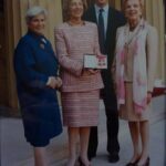 HP: Getting her CBE at Buckingham Palace, 2000