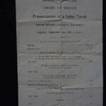 KM: Order of Service from Cricklewood Synagogue, February 5, 1936, to commemorate the presentation of the Sefer Torah brought by the Jawne School as a gift to their new host community. "It was quite a- quite a story. It's one of these interesting things really- it’s symbolic. The wandering Jew takes his Sefer Torah with him."