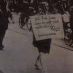 BG: Father Dr. Michael Siegel being marched round Munich after going to the police station to complain on behalf of a Jewish client whose shop had been damaged, Munich, 10th March 1933. "My father had gone to the Police Headquarters to launch a complaint on behalf of a client whose store had been damaged and he’d been taken prisoner. And they said to him, oh Dr. Siegel, you are wanted in room number so-and-so which happened to be in the basement where he found a whole lot of Brownshirts who beat him up and kicked in his teeth, bashed his eardrums, cut off his trouser legs and marched him round Munich like that for an hour maybe, let him go near the main station. Now he never told me this, but he told it to a cousin of mine, they then said ‘go!’ and as he was going they cocked their rifles and said: “Jetzt stirbst du, Jud’!” Now you are going to die, but they never actually fired a shot. So he got into a taxi and a man came up to him and said, look I have just taken some photographs do you mind if I publish them and my father said, do what you like. And that was the photographer... And he sent it off to America, and he was afraid to use it in Germany because apparently the other story is that when Hitler actually got to hear of it he was furious because he did not at that point want that sort of behaviour to be known."