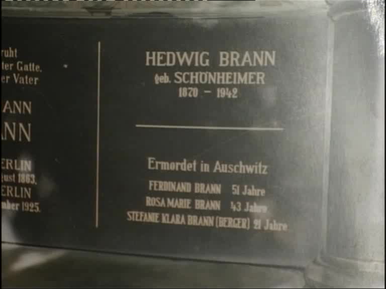 UG: Family grave in Weißensee. "This is part of it where my grandmother’s name was engraved and there was room left, and I felt is was more than fitting that I should put down that my parents were ermordet [murdered] in Auschwitz. Ferdinand Brann who was 51 years old, Rosa Marie Brann who was 43 years old and Stefanie Klara Brann (Berger) because she got married on special permission a day before her deportation, and she was then 21 years old."