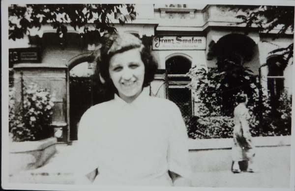 WK: Sister Ruth (Ruthie) outside the family house in Vienna, Seven Ausstellungsstrasse, early 1938. "She was a lovely person. Unfortunately she was too young to get a working permit, and too old to go to- on to the Kindertransport. So she stayed in Vienna. Went to Theresienstadt and died in Auschwitz."