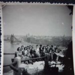 GB: Gustav on an excursion with friends, sitting on a viewpoint, behind them the Danube river and the city, Budapest, 1950s