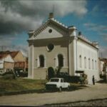 ES: Restored synagogue, Austerlitz, Slavkov, 1994. "And the synagogue when we first saw it was really very neglected and we had it renovated, and the town and the Ministry of culture in Prague managed to get enough funds to have it renovated and this was taken in 1994, shortly after the completion of the renovation. It’s a complete change and it looks beautiful now."