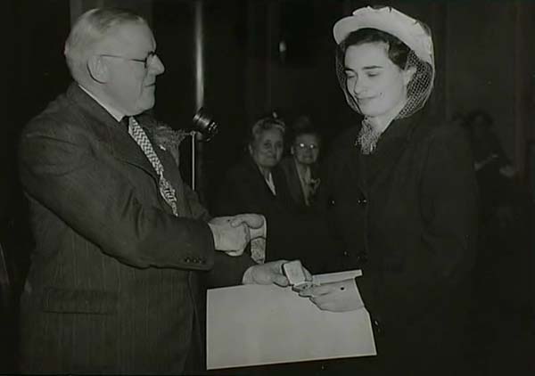 HG: Receiving her Gold Medal as best nurse in the London County Council Hospitals, County Hall, London, 1947. "It was a very exciting moment."