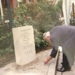 NB: Llghting candles at a stone remembering the synagogue in Hockenheim, 2005