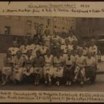 HS: Class at school, 1934. "And you see quite a number of the girls in white shirts and black skirts. They were girls in the Hitler Youth., maybe they were going on to a meeting or something. They wouldn’t necessarily wear it all the time. And as there was no school uniform they’re pretty obvious."
