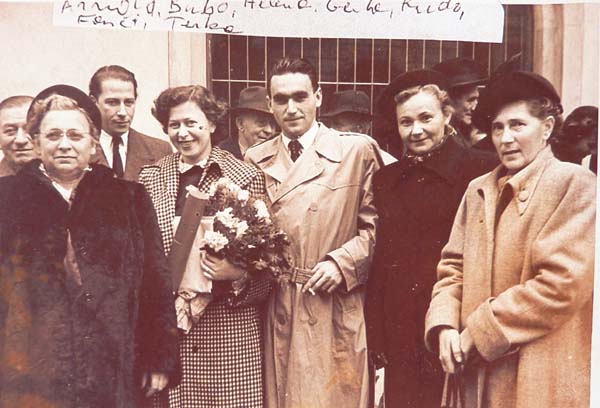 GV: Gerta with flowers after her graduation, from left: uncle Arnold, mother-in-law Helena, Gerta, “Rudi”, his step-sister Fanci, uncle Arnold´s wife Terka, Prague, 1950