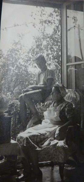 JD: With mother at the window of the last flat they rented in Budapest, 2nd District, Kupeczky Utca het, 7 Kupeczky Street, a month before the family came to the UK, July 1948