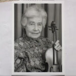 ML:"Picture of me here in my music room. My violin is an Amati"