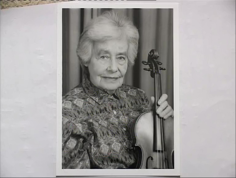 ML:"Picture of me here in my music room. My violin is an Amati"