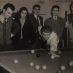 EF: EF with other members of the Primrose Youth Club. Most of these boys are concentration camp survivors celebrating the opening of a new house on Finchley Road for the club in 1952 with a game of snooker.
