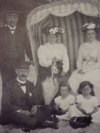 VM: Great-grandmother's family on a seaside holiday in Heringsdorf. "The family went there for many years, and I remember going there as a small child." VM's great grandmother sitting in the basket chair on the right, great-grandfather standing on the left, and their cousins. VM's mother is the child on the right.