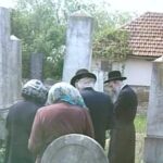 RR: With her family at the kevorim from her grandparents, RR in maroon, San Niklaus , 1999