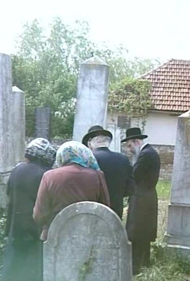 RR: With her family at the kevorim from her grandparents, RR in maroon, San Niklaus , 1999