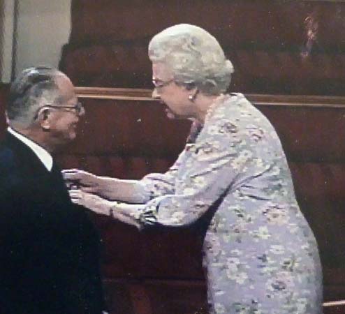 HJ: Receiving his MBE from the Queen at Buckingham Palace, 2006