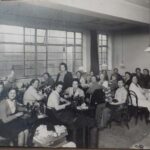 RD: Doing sewing 'war work', Bruton Street, 1945. Ruth at the very left, And Mrs. Heinzitz in the middle standing up. "She owns all that area. She, she, she had- that was her business."