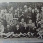 JD: Sitting on the ground to the right in his English class at the Ancient School boarding school he was sent to post war, ca 1947