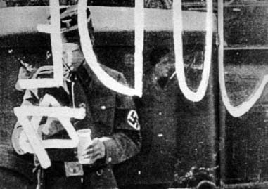 Nazi daubing Jewish shop during Kristallnacht, 9th November 1938